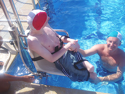 Photo of Christopher entering pool