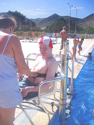 Photo of Christopher entering pool